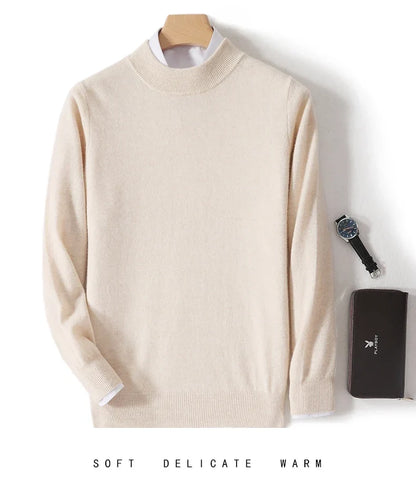 Cream mock neck jumper on a hanger with white shirt underneath, watch and dark wallet beside it 8