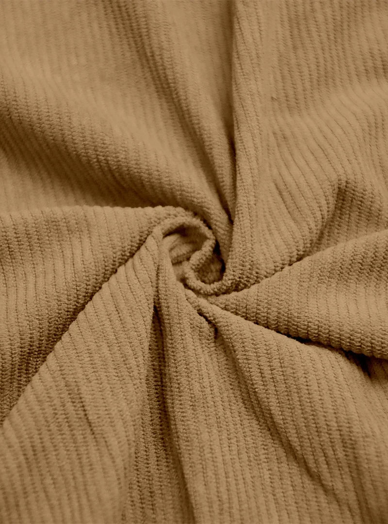 Close-up of tan ribbed fabric twisted into a swirl to show its texture 8