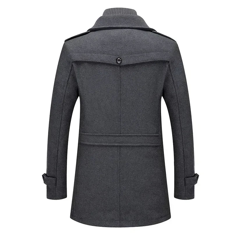 Back of the grey coat, with a buttoned yoke, belted waist panel and buttoned cuff straps 8