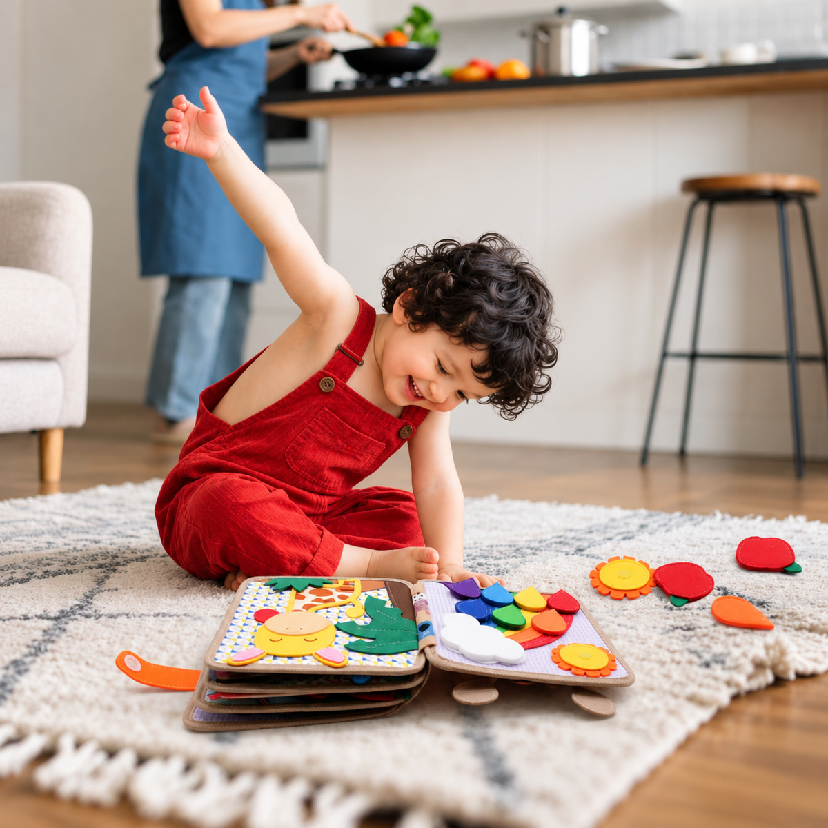 Toddler in red dungarees sitting on a rug, playing with the open giraffe book and felt pieces 9
