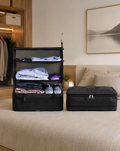 Opened organiser filled with clothes beside a second, fully zipped-up one, both resting on a bed 13