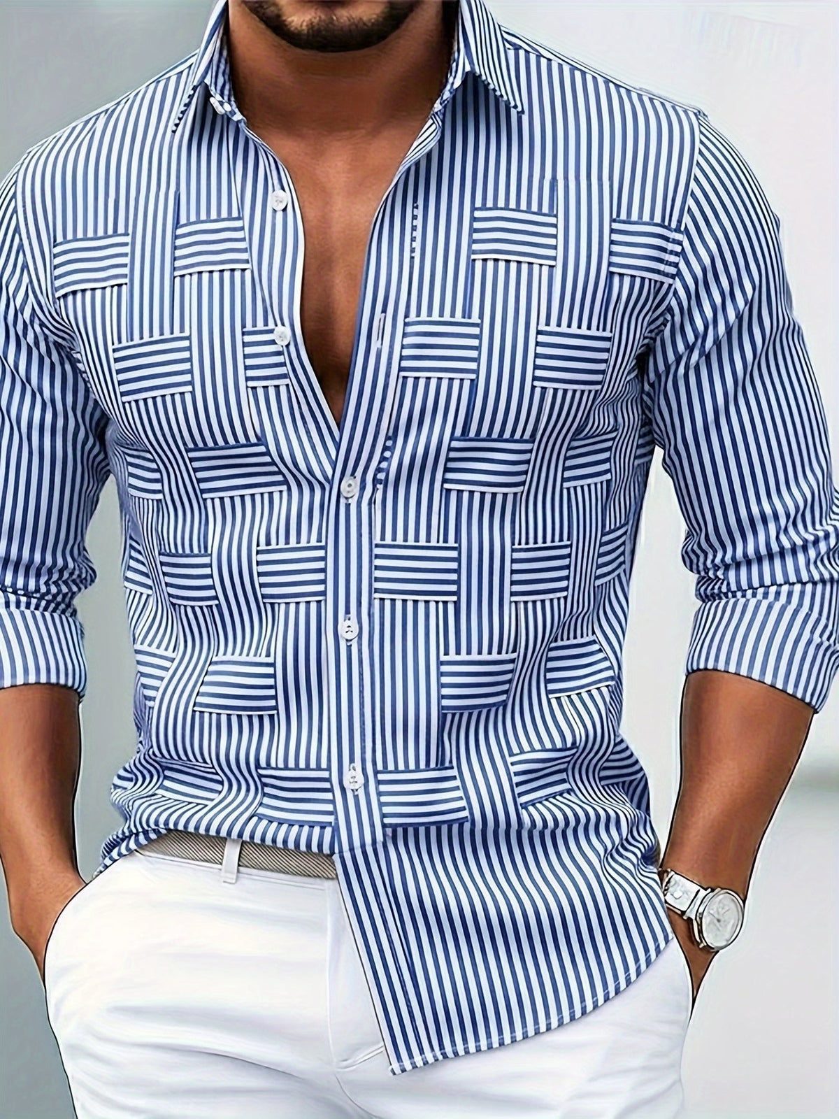 Front view on a model of the blue and white striped shirt, partly unbuttoned, with woven-style panels, worn with white trousers. 1