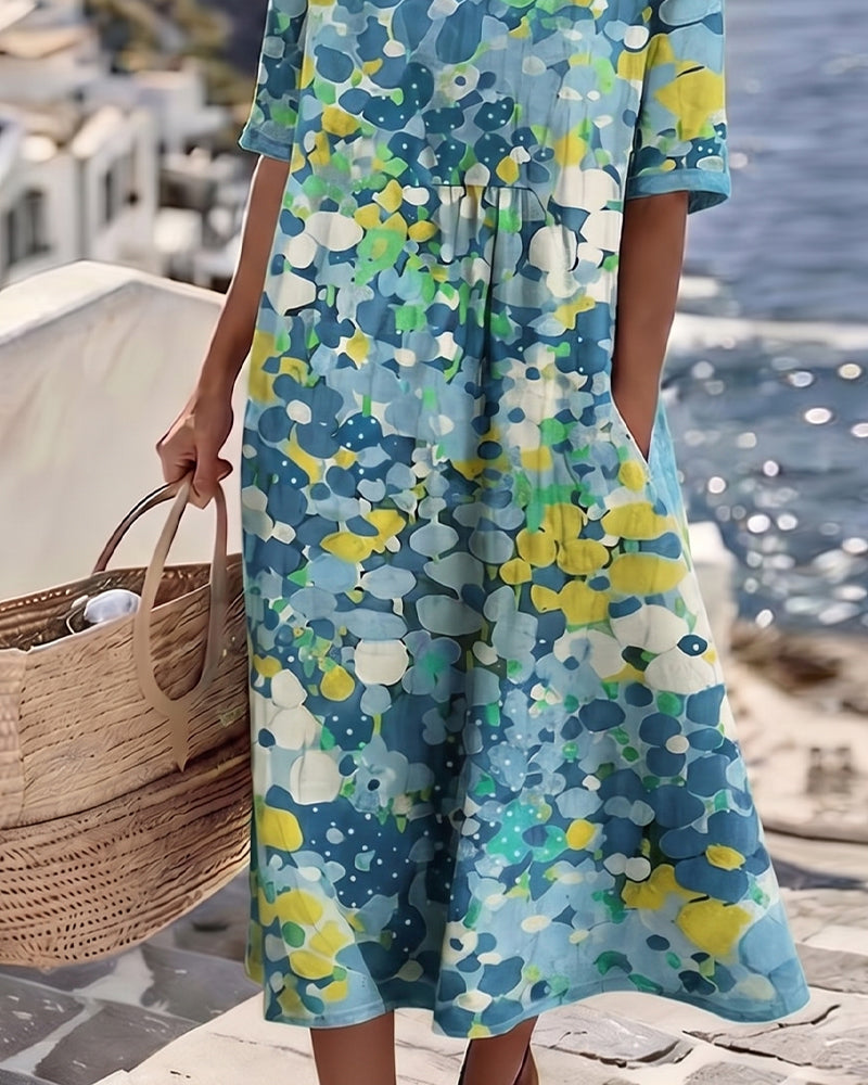 Lower-body detail of the blue floral dress showing the loose skirt and side pocket 11