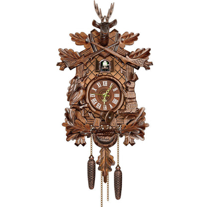 Traditional carved cuckoo clock with stag head, crossed rifles, oak leaves, bird and hare carvings, Roman numeral dial and two cone weights. 10