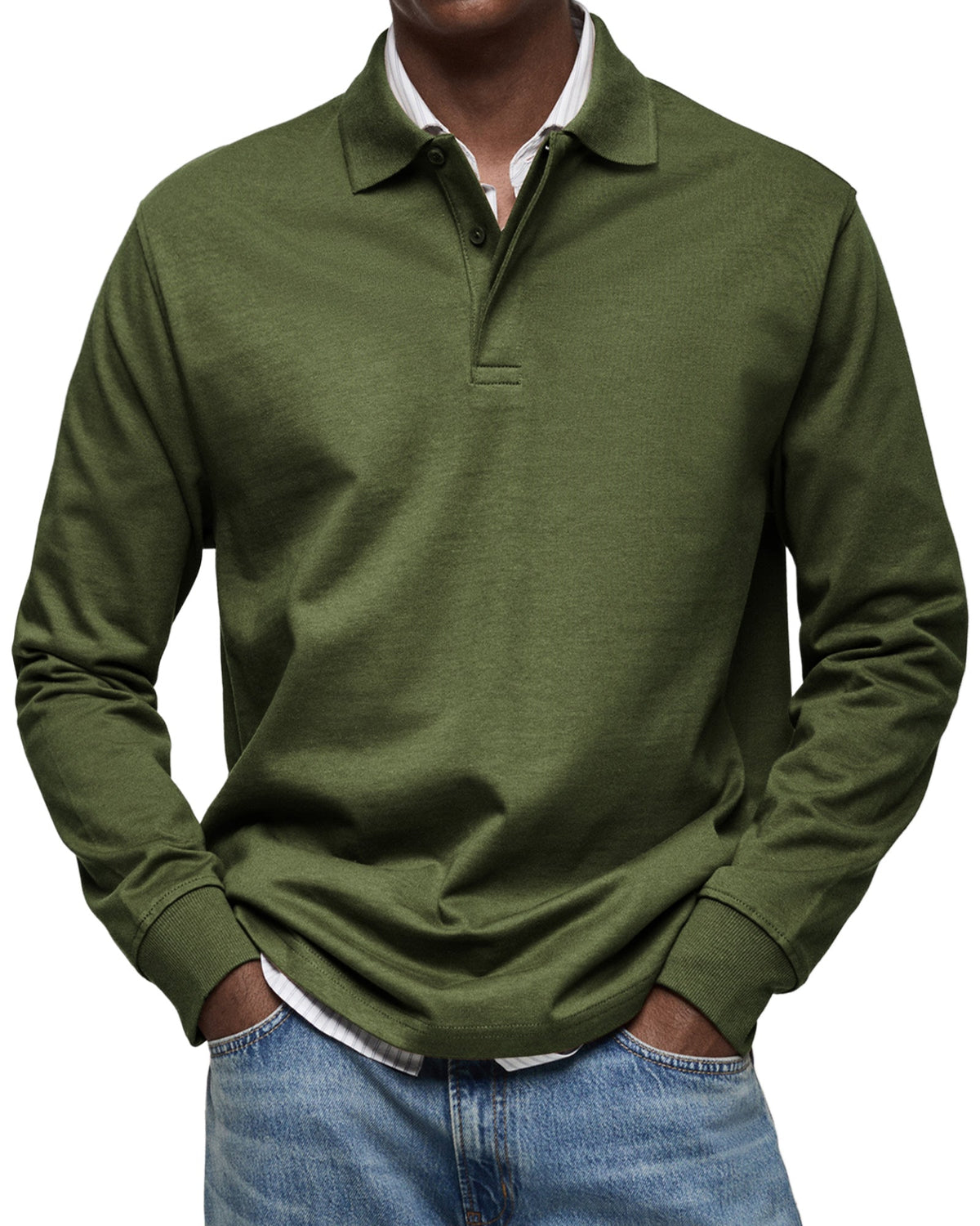 Model wearing the polo in dark olive green, ribbed cuffs and buttoned collar, layered over a striped shirt. 10