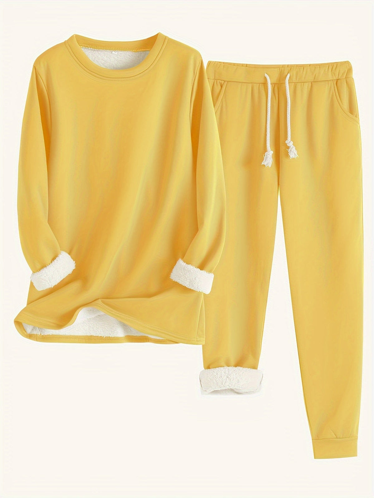 Flat lay of the set in bright yellow, with white fleece lining rolled out at cuffs 6