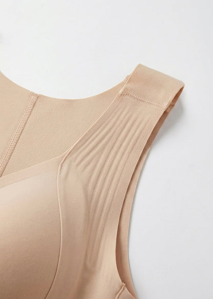 Flat close-up of the beige bra's wide ribbed shoulder strap, stitched seam and smooth cup edge. 10