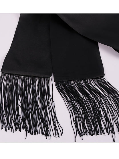 Close-up of the black satin sash with long fringed tassels at both ends 8
