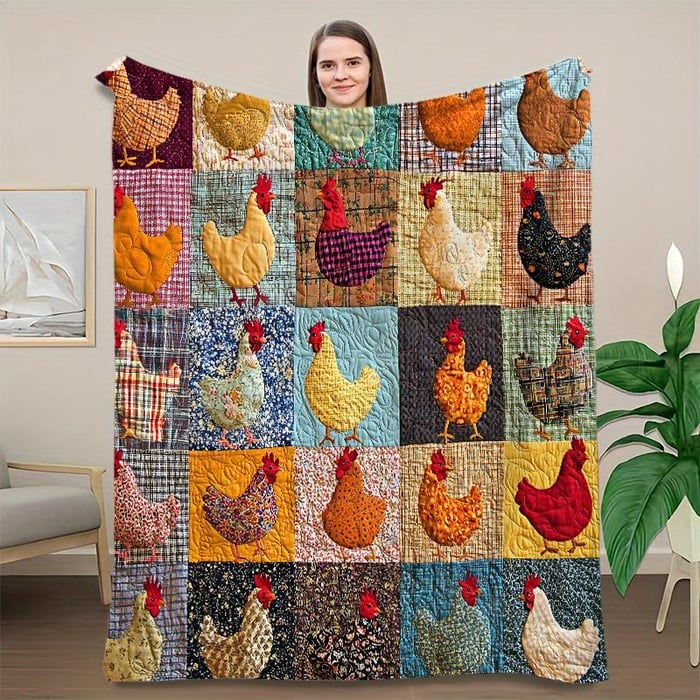 Woman holding up the colourful patchwork chicken blanket, showing the full grid of chicken squares 2