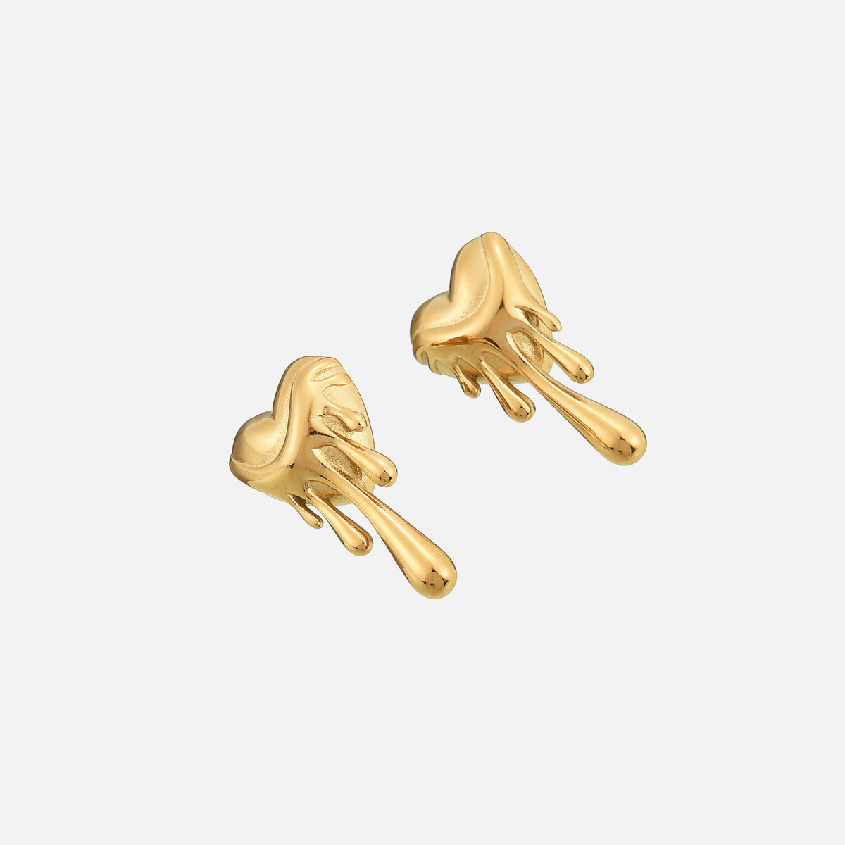 Gold-tone melting heart earrings photographed at an angle, showing the depth of the heart and the rounded drip shapes. 2