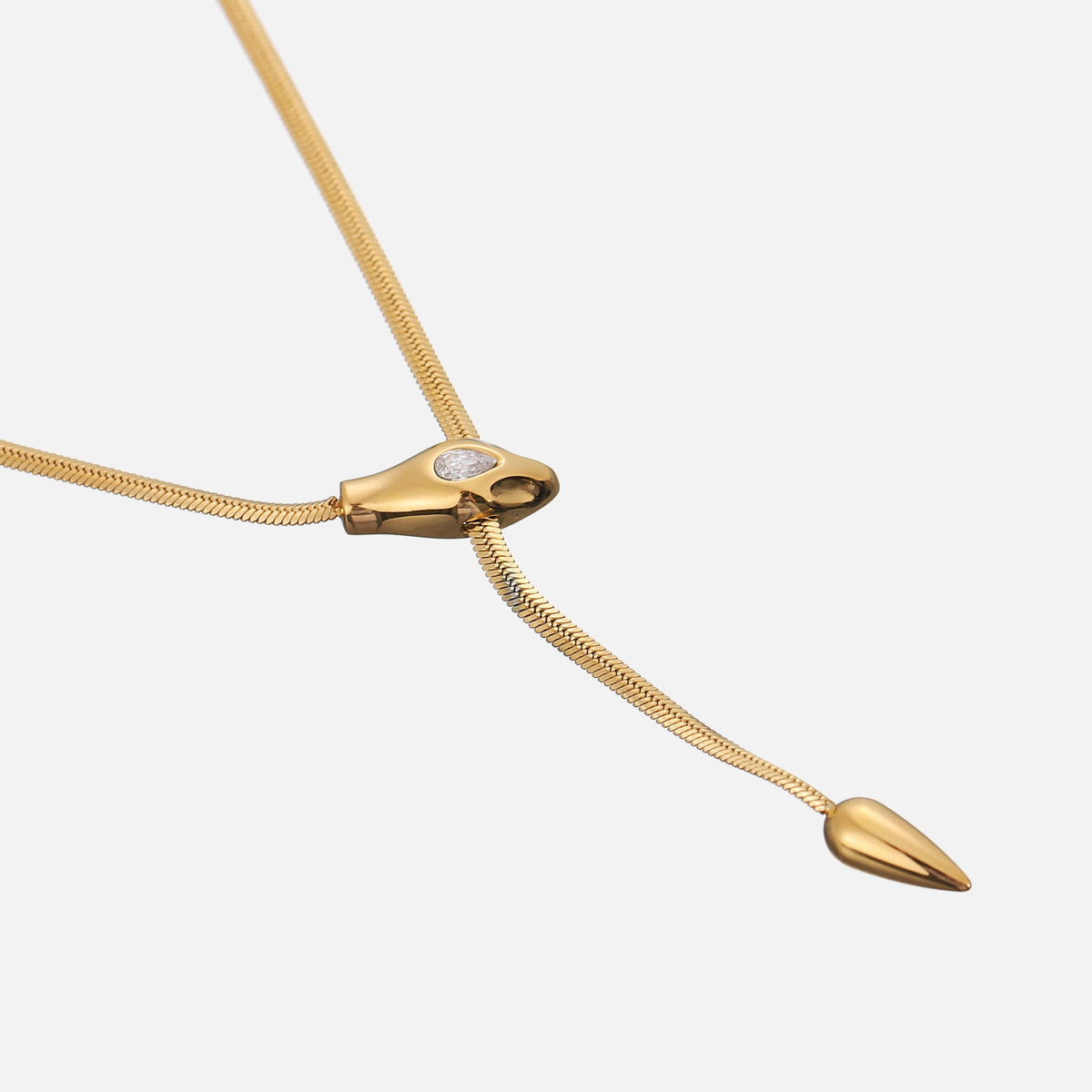 Angled close-up of the snake-head slider and pointed drop end on the flat gold chain 2