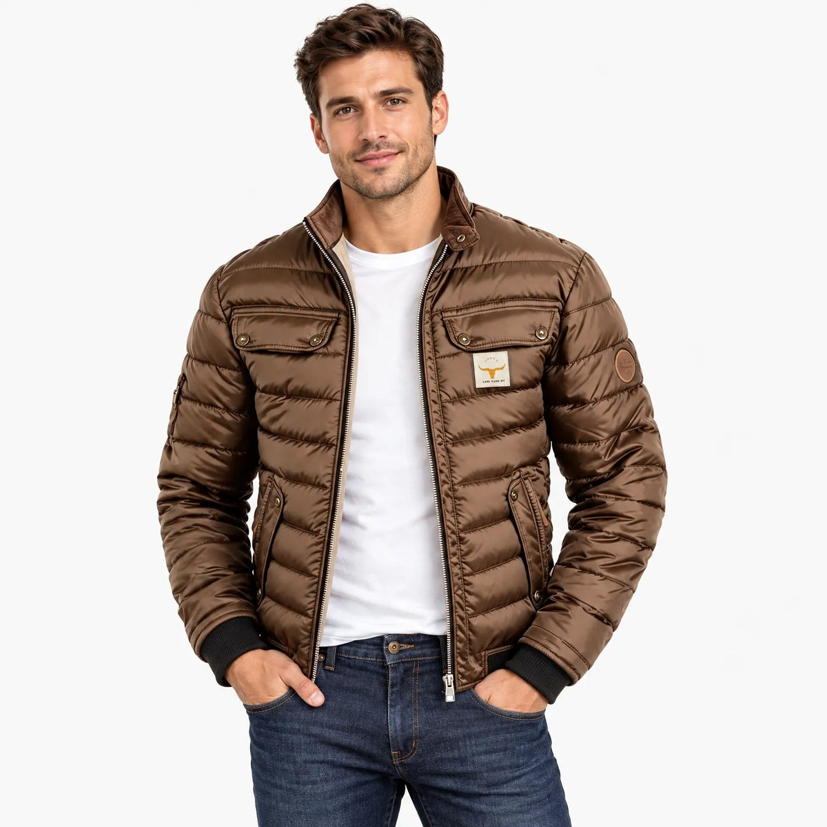 Smiling model wearing the brown quilted jacket open over a white t-shirt and dark jeans 9