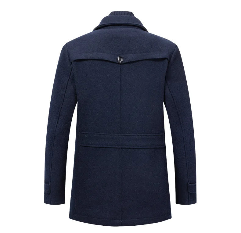 Back view of the navy overcoat, showing the buttoned yoke flap and the waist strap 9