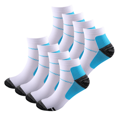 Eight white ankle socks with blue arch panels and dark grey heels and toes, stacked in two staggered rows of four. 7