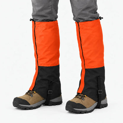 Orange and black gaiters worn over hiking boots against a white background, showing the zip, top drawcord and instep strap. 12
