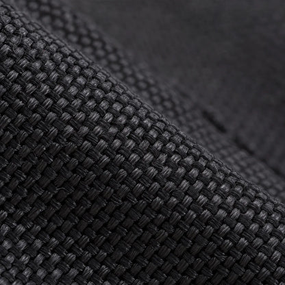 Close-up of the black woven fabric used on the lower part of the gaiters, showing the tight textured weave. 5