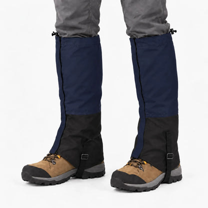 Navy blue and black gaiters worn over hiking boots, with toggle cords at the top and a strap under the boot. 6