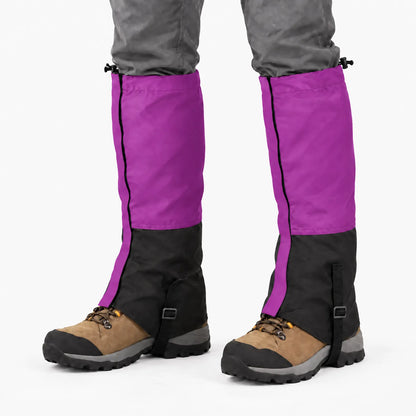 Purple and black gaiters worn over tan hiking boots against a white background, showing the side zip and boot strap. 8