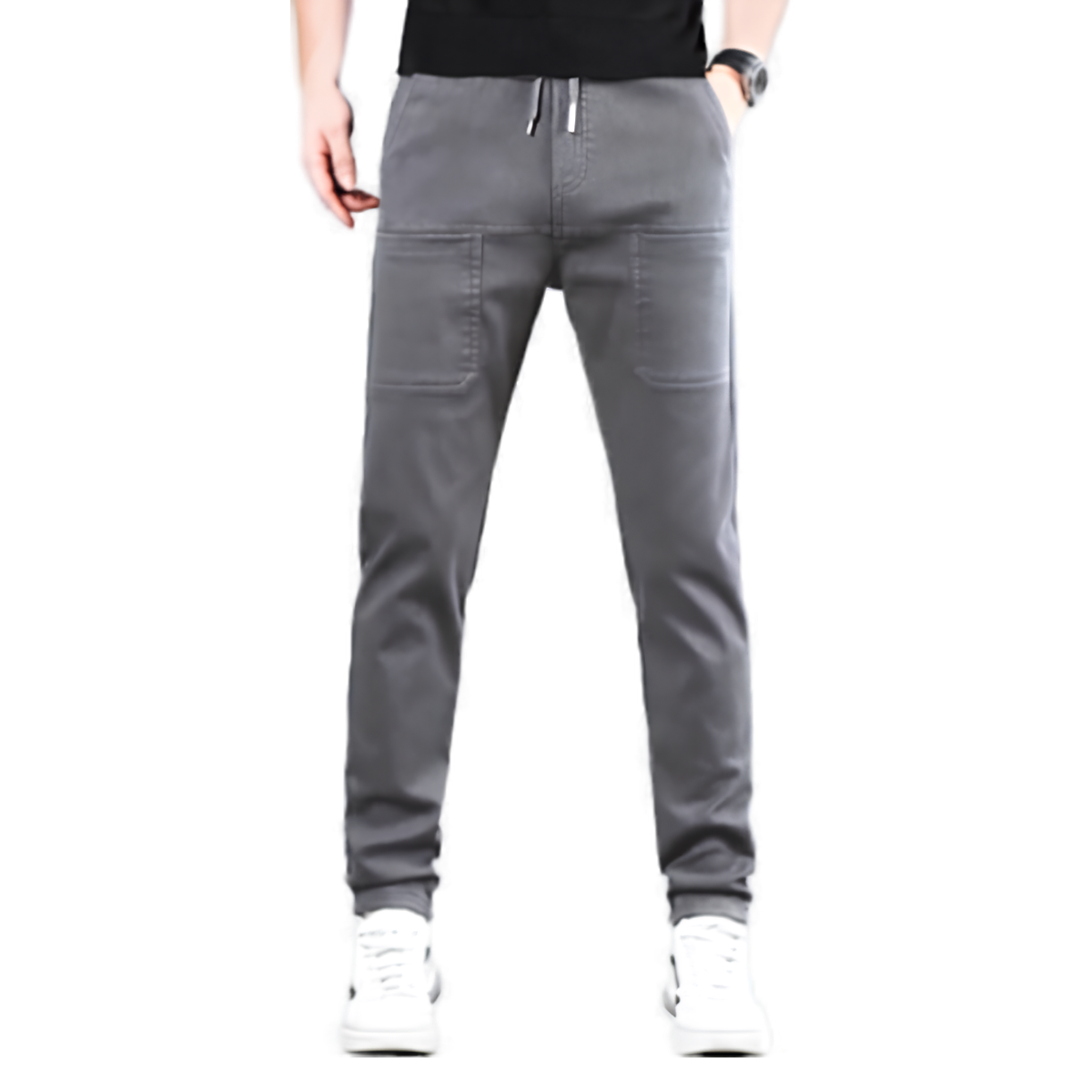 Grey drawstring cargo trousers with two large front patch pockets, worn by a model with white trainers 1