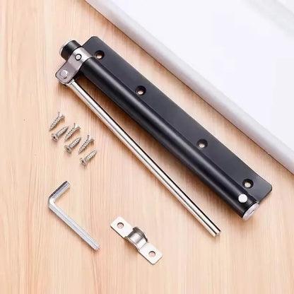Black closer laid flat on a wooden surface with its screws, Allen key and door bracket 7