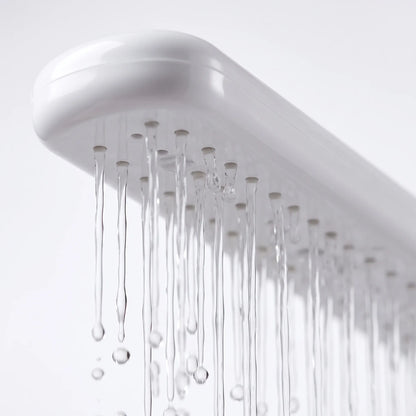 Close-up of the underside of the white spray arm, showing the row of small outlets with thin streams of water running out. 3