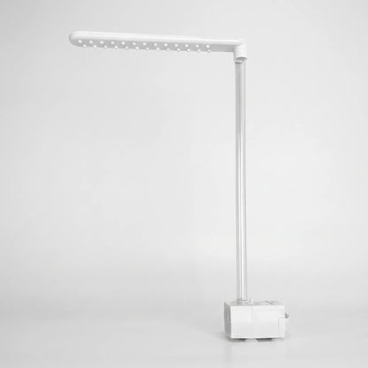 Dry unit on a plain background, showing the underside of the spray arm with its nozzles, the clear tube and the pump base with suction feet. 5