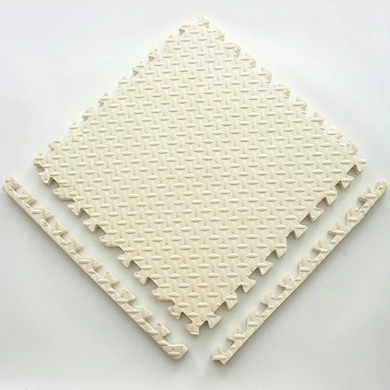 Single cream foam puzzle tile with a textured leaf pattern, shown flat with two separate border edge pieces. 13