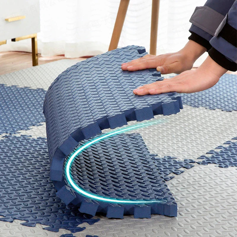 Hands bending a navy foam tile to show how flexible it is, with a glowing curved line tracing the bend. 4