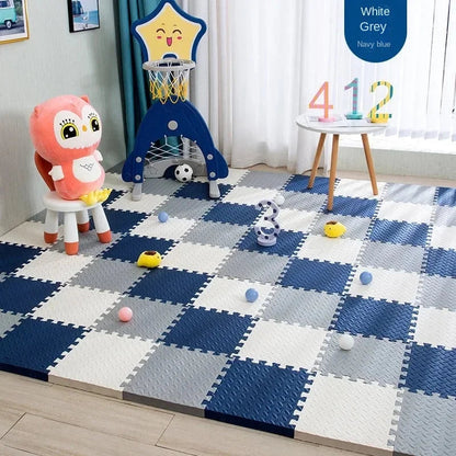 Navy, grey and white foam tile flooring in a playroom with a toy basketball hoop, a small owl stool and play balls. 7