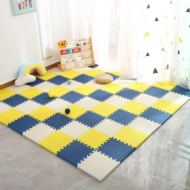 Yellow, navy and cream foam tiles in a chequered pattern on a tiled floor beside a children's bookshelf and play balls. 8
