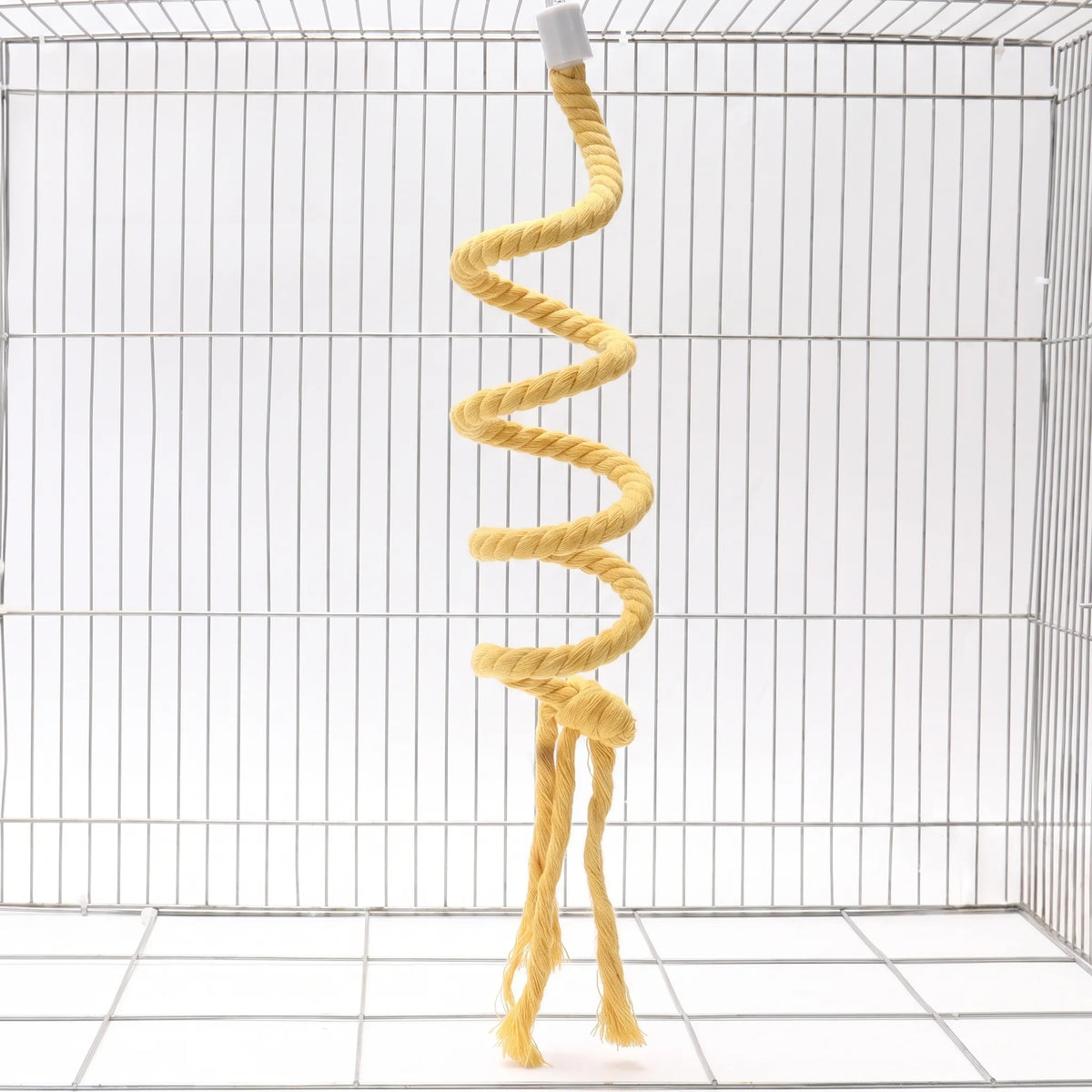 Yellow twisted rope perch coiled into a spiral, hanging from a white cap inside a wire cage, with knotted, frayed ends. 1