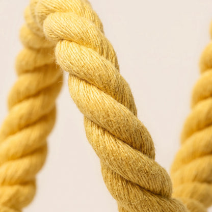 Close-up of the twisted yellow rope showing the thick, fibrous strands and soft, slightly fuzzy texture. 3