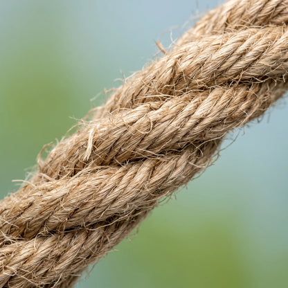 Close-up of the twisted, fibrous natural rope, showing its rough texture and loose strands against a soft green and blue background. 4
