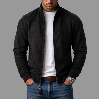 Black zip-up jacket worn open over a white T-shirt and blue jeans, with ribbed cuffs and a leather zip pull. 1