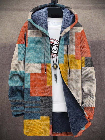 Hooded zip-up cardigan with patchwork colour blocks in orange, teal, yellow and grey, fleece-lined, on a stand 1