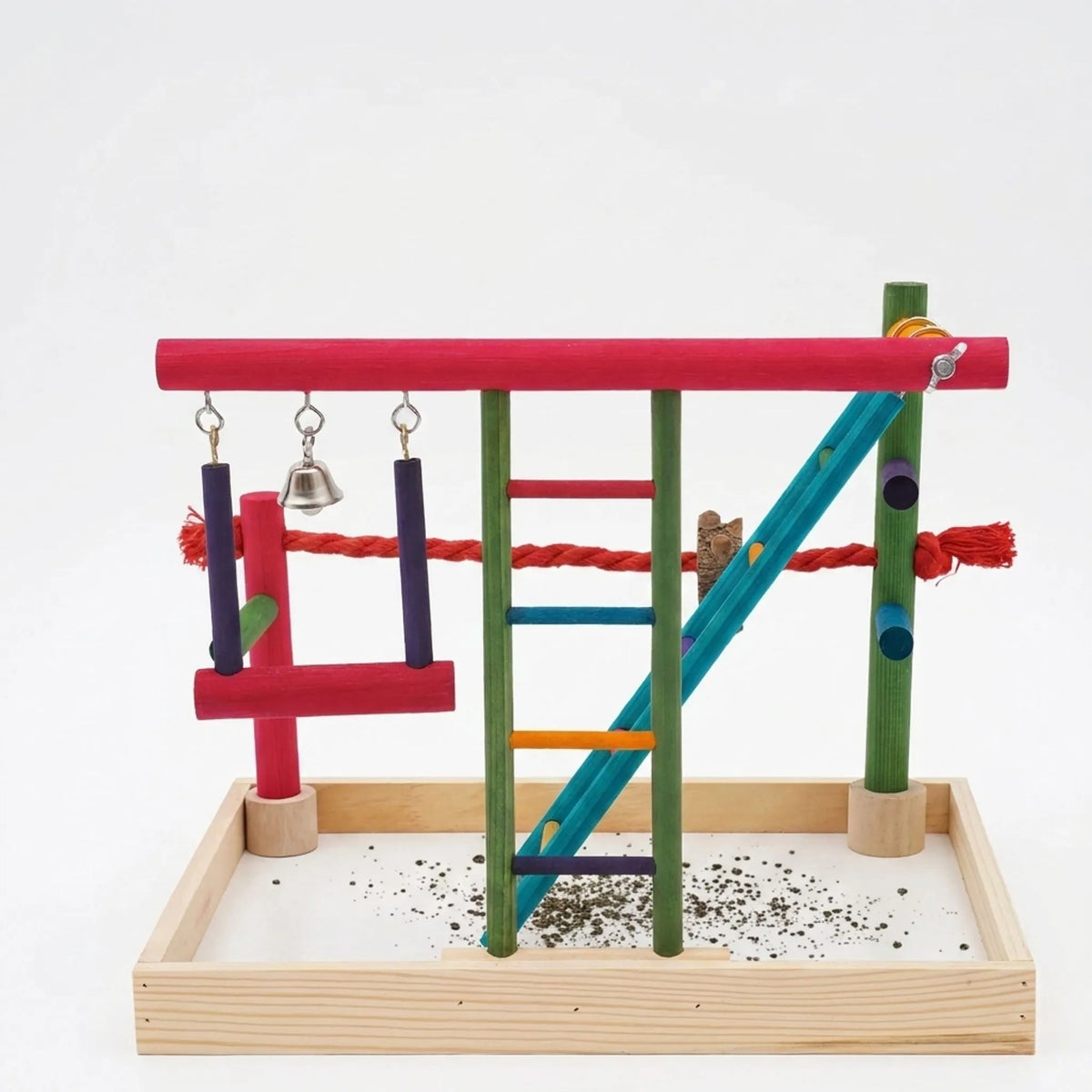 Front view of the colourful wooden bird playground on a plain white background, showing ladder, swing, bell, rope perch and seed tray. 1