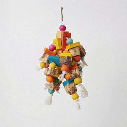 A different, chunkier toy design with flat coloured wooden slats, round beads, natural nut-shell pieces and rope tassels on a plain background. 5