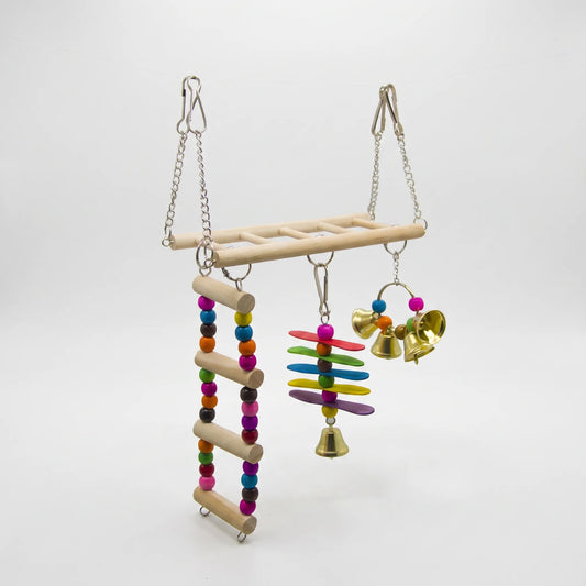 Wooden perch swing hung on chains, with a beaded rope ladder, coloured wooden slats and a cluster of gold bells beneath, on white. 1