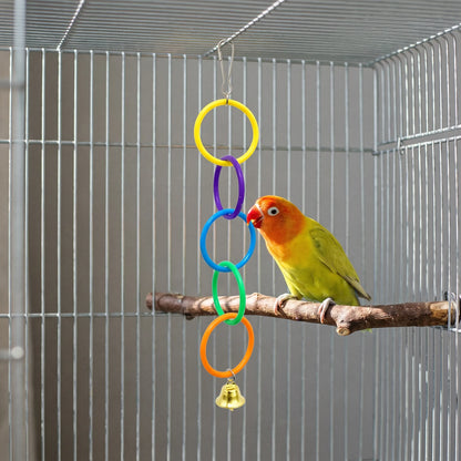 A lovebird on a wooden perch nibbles the blue ring of the hanging chain inside a wire cage. 3