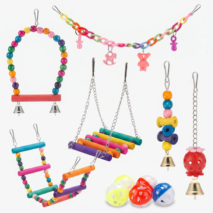 Flat lay of the whole set on white: beaded swing, plastic chain, two ladders, hanging toys, bells and perforated balls. 1
