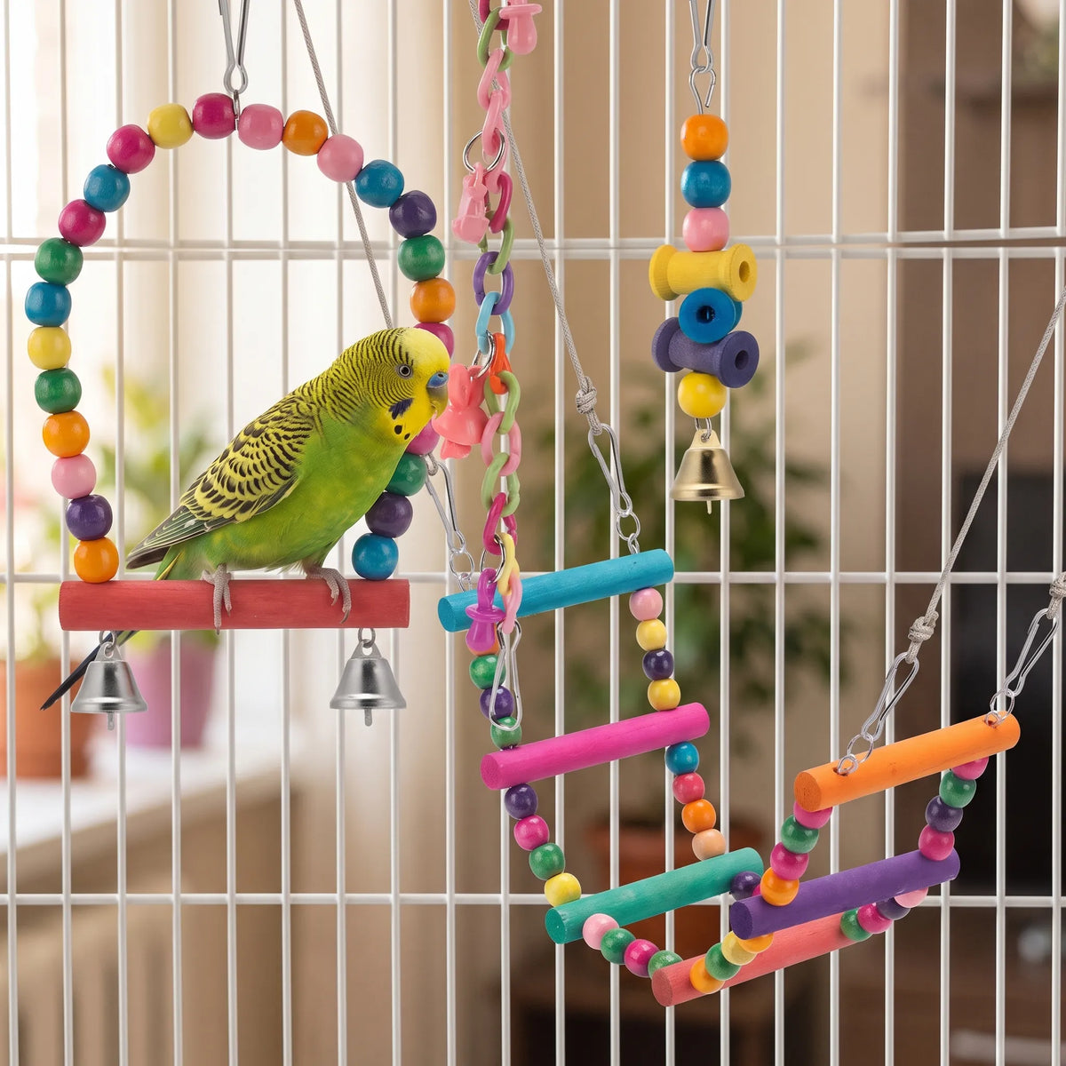 Several of the toys hanging inside a cage, with a green and yellow budgie perched on the beaded swing. 2