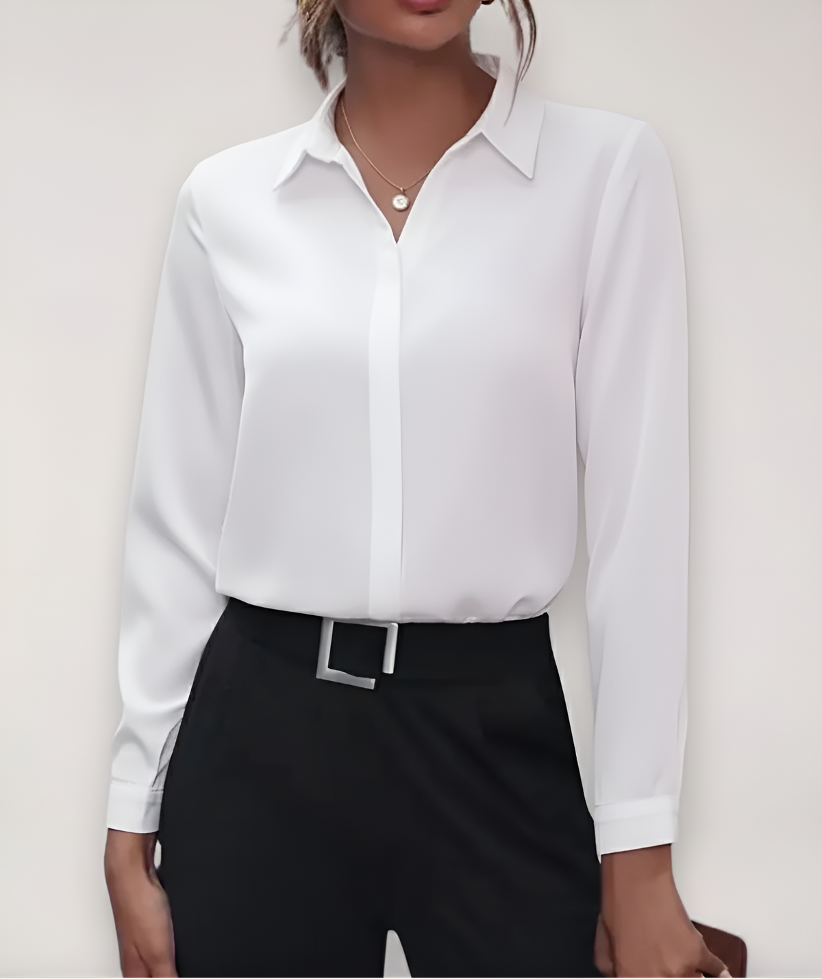 White blouse with hidden button placket, worn by a model with black trousers and a belt 5