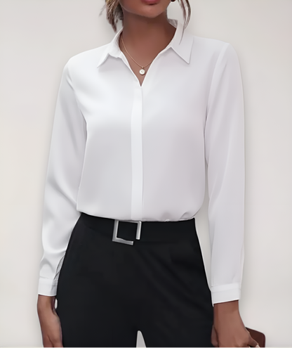 White blouse with hidden button placket, worn by a model with black trousers and a belt 5
