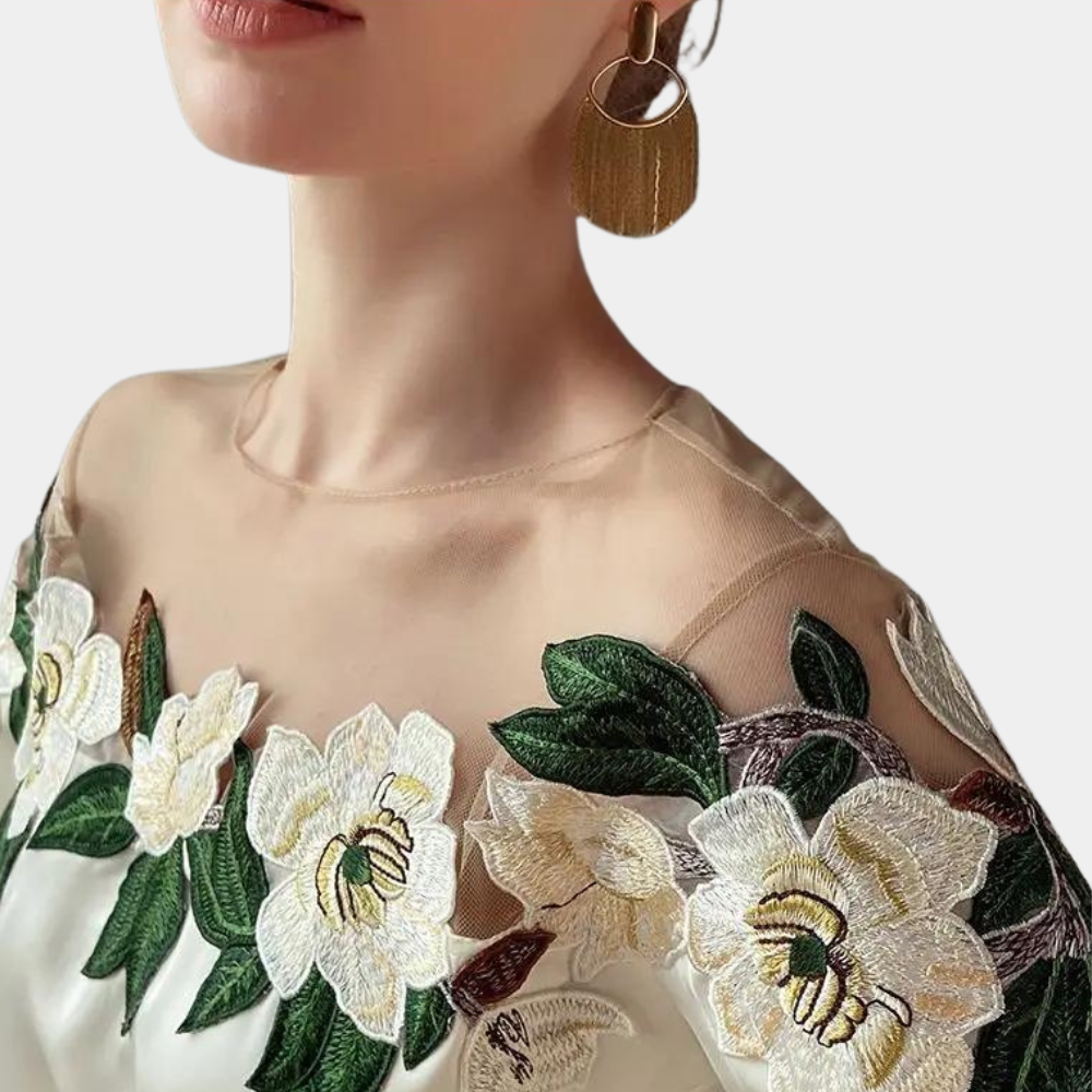 Beige women's blouse with autumnal floral print and a relaxed fit – Elvira