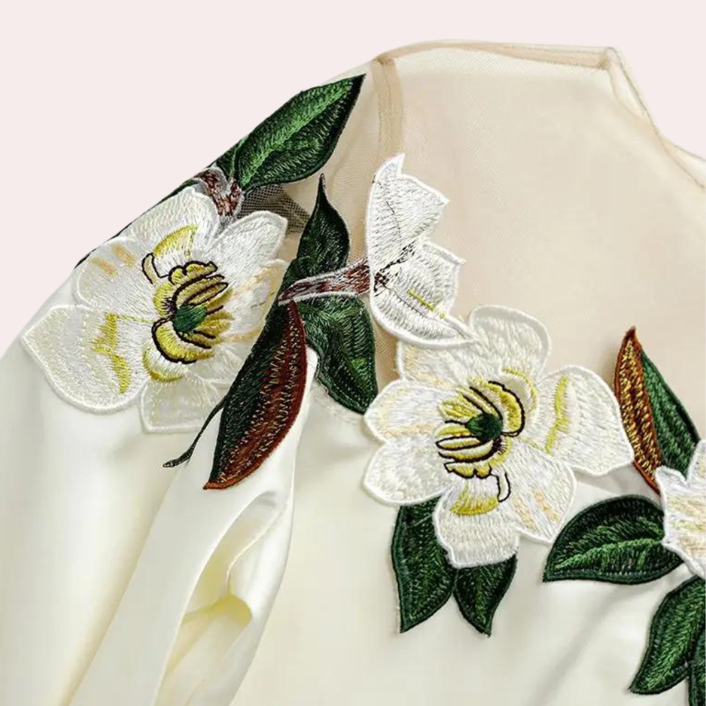 Beige women's blouse with autumnal floral print and a relaxed fit – Elvira