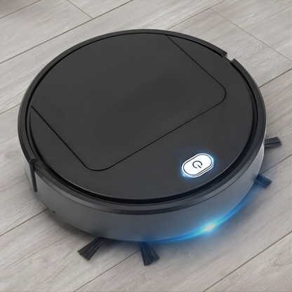 Black round robot cleaner on a light wood-effect floor, with a glowing power button, blue light strip and side brushes. 2