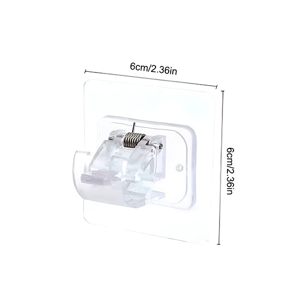 Single clear adhesive clip with spring on a white background, with size markings showing a square base. 10