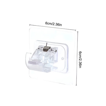 Single clear adhesive clip with spring on a white background, with size markings showing a square base. 10