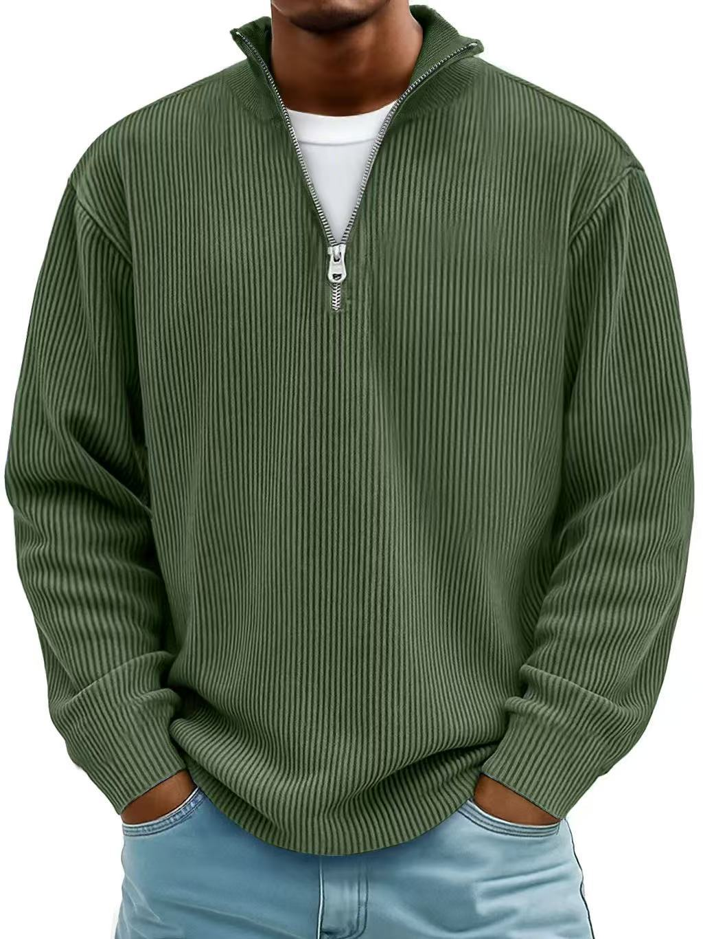 Man wearing the half-zip ribbed jumper in olive green over a white tee, hands in jeans pockets 8