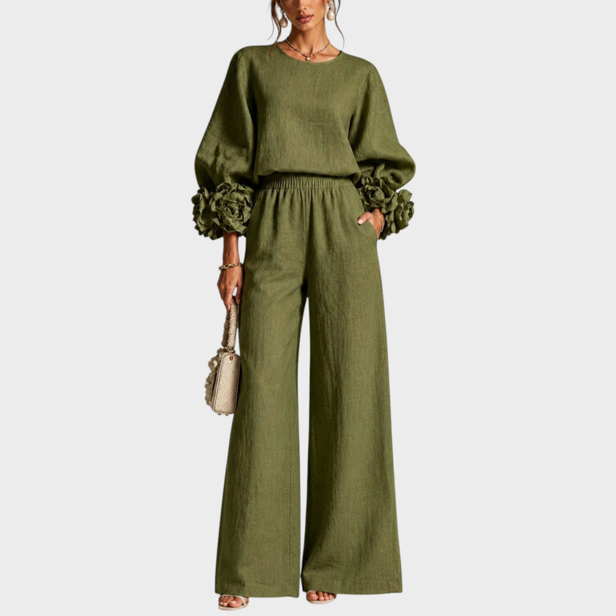 Model in the olive green set, front view, one hand in the trouser pocket 4
